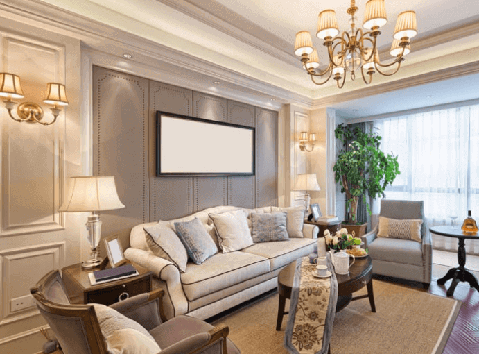 A luxurious living room with modern furniture and flat screen TV