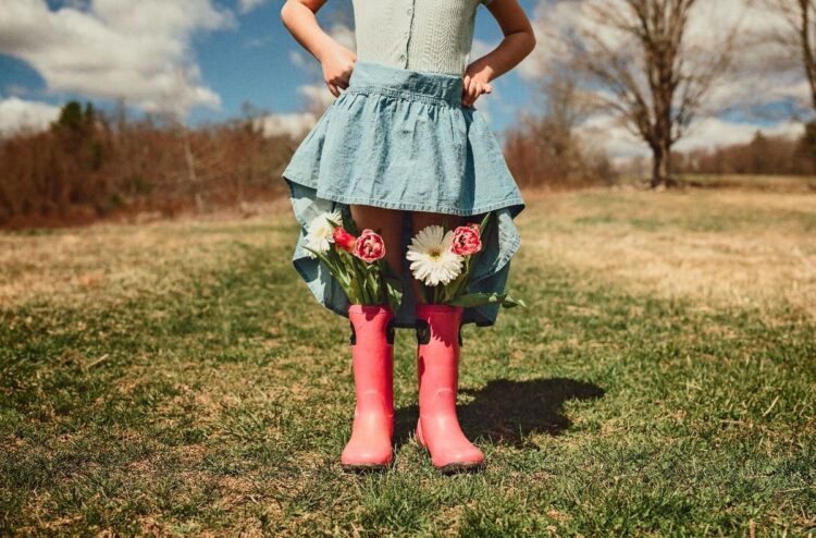 beautiful view of a young female child with flower