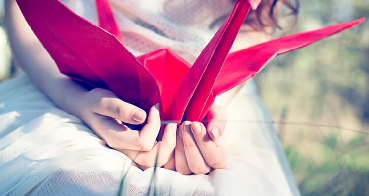 girl holding paper craft