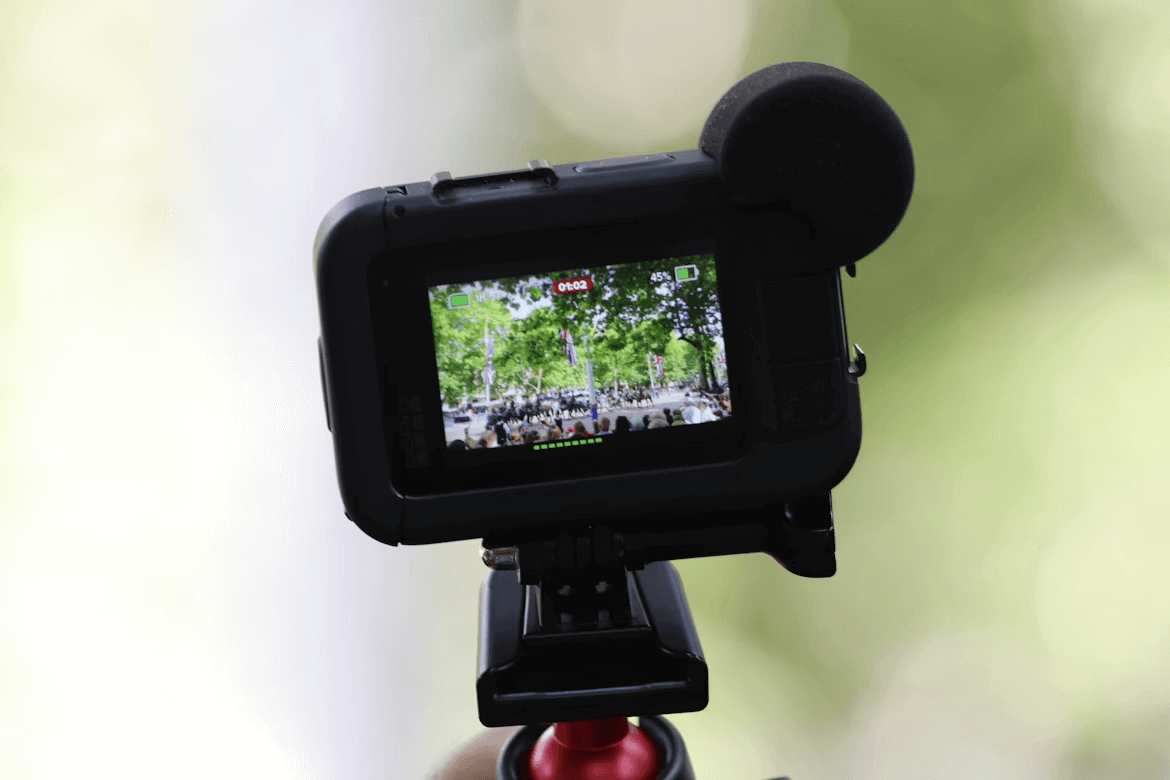 Person holding camera to capture video for upselling strategies