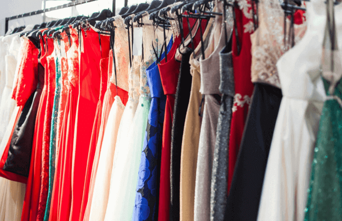 Rack of colorful dresses hanging on wall