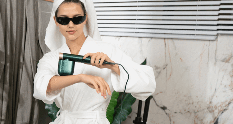 Woman removing hair wearing white robe