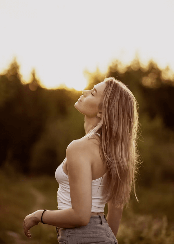 Woman in field projecting confidence and style