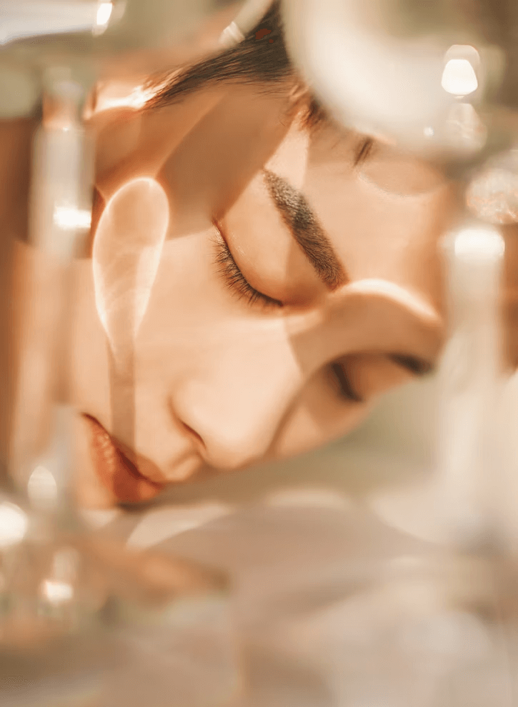 Woman resting head beside wine glass at table in fashion and nutrition blog
