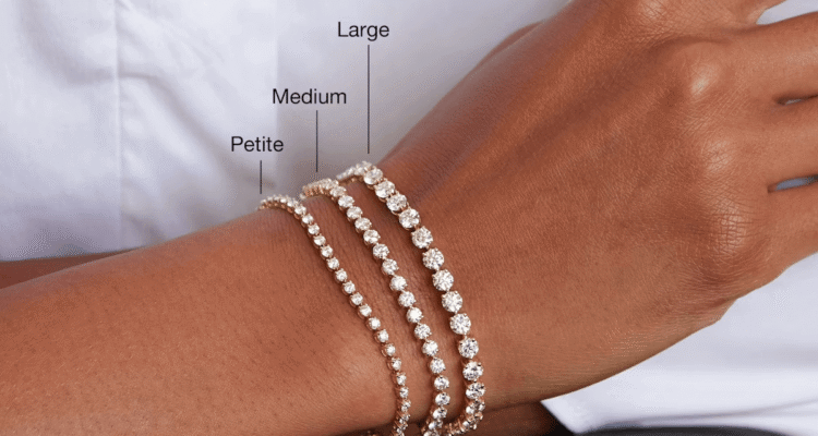 Woman wearing a white shirt with tennis bracelets on wrist