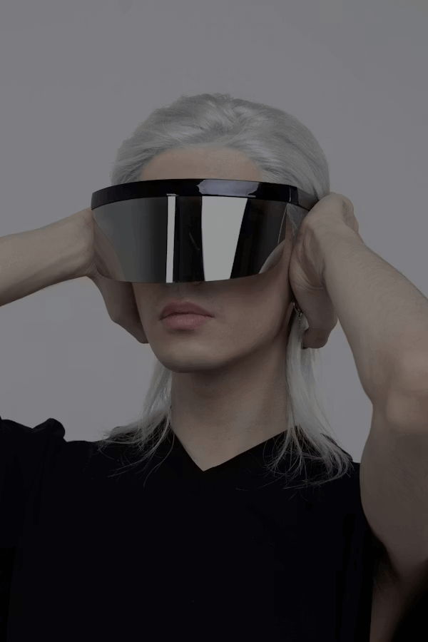 Woman wearing virtual reality glasses experiencing virtual fashion